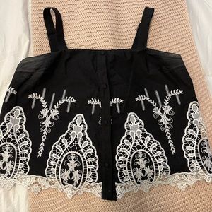 black blouse with white detailing